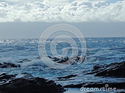 Coastline and rugged lava rocks called Dragonâ€™s Teeth and crashing waves at Makaluapuna Point near Kapalua, Maui, HI, USA Stock Photo